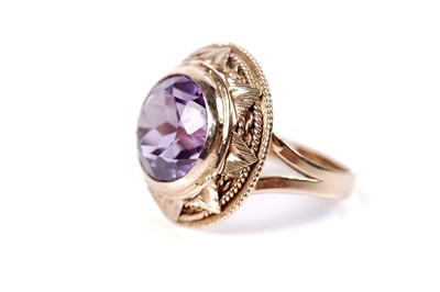 Lot 1229 - An Egyptian synthetic colour-change sapphire ring