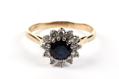 Lot 480 - A sapphire and diamond cluster ring