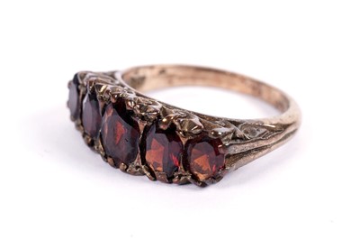 Lot 447 - A five-stone garnet ring