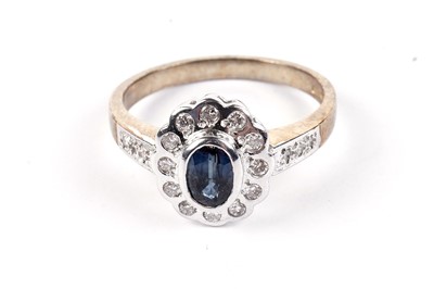 Lot 460 - A sapphire and diamond cluster ring