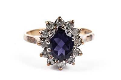 Lot 467 - A sapphire and diamond cluster ring