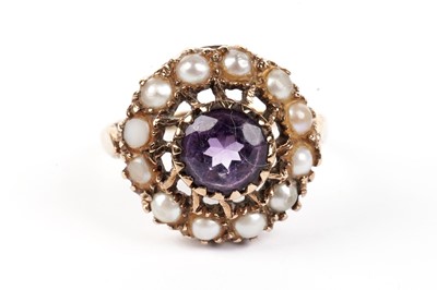 Lot 473 - An amethyst and pearl cluster ring