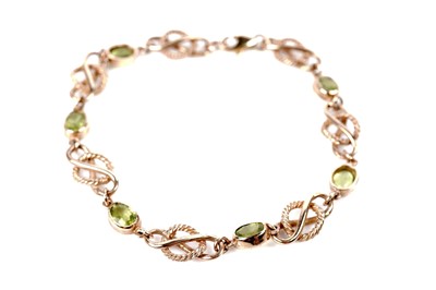 Lot 1236 - A peridot and 9ct yellow gold bracelet