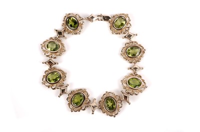 Lot 1237 - A peridot bracelet