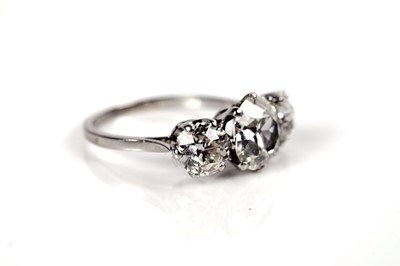 Lot 1285 - A three stone old-European cut diamond ring