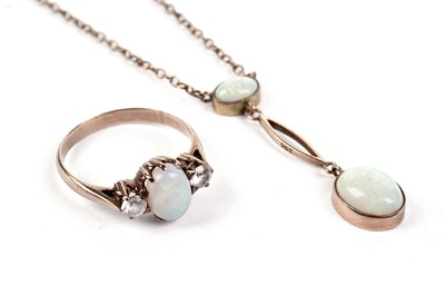 Lot 662 - An opal and white sapphire ring, and an opal pendant necklace