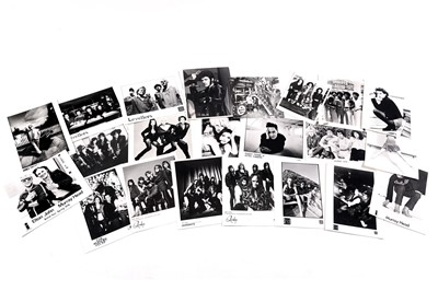 Lot 1414 - Record label promotional black and white photographs of bands and musicians