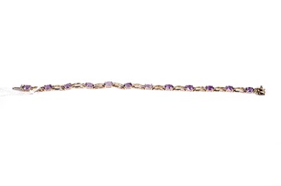 Lot 607 - An amethyst and diamond bracelet