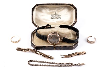 Lot 666 - A lady's 9ct gold cased wristwatch and other yellow metal jewellery items