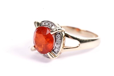 Lot 615 - A fire opal and diamond cluster dress ring