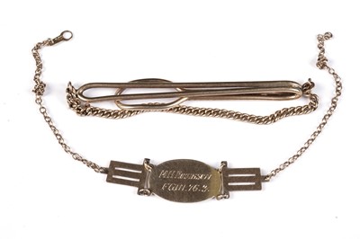 Lot 694 - A 9ct yellow gold tie clip; and a gold identity bracelet