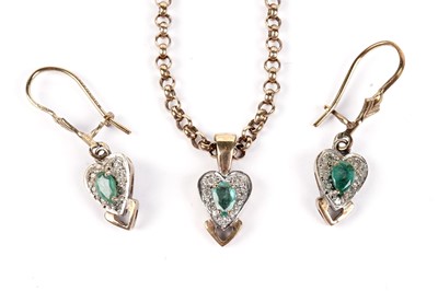 Lot 498 - An emerald and diamond pendant and matching earrings