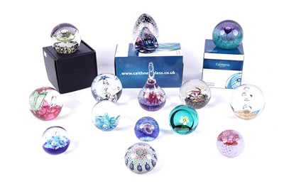 Lot 137 - A collection of glass paperweights from various makers including: Caithness