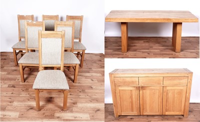 Lot 37 - A contemporary eight-piece oak dining room suite