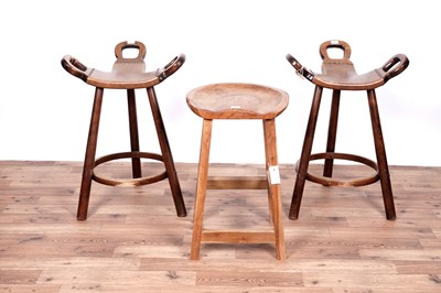 Lot 32 - A pair of stained beech brutalist ‘Marbella’ style barstools; and an oak barstool