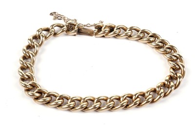 Lot 673 - A gold curb-link bracelet