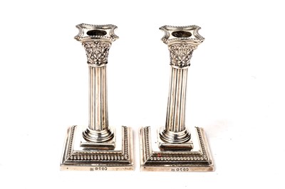 Lot 1550 - A pair of Victorian silver dwarf candlesticks