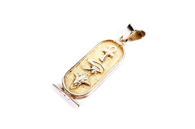 Lot 656 - An Egyptian yellow gold hieroglyphics pendant