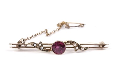 Lot 651 - A Victorian ruby and seed pearl bar brooch