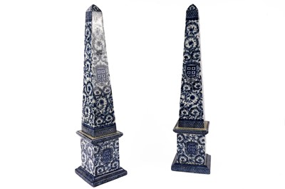 Lot 347 - A pair of 19th Century style blue and white ceramic obelisks