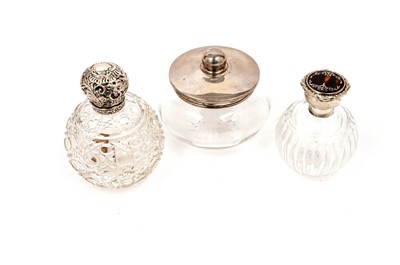 Lot 784 - Three silver mounted dressing table bottles