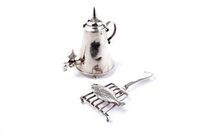 Lot 1730 - A miniature Dutch urn; and a miniature fish on a griddle