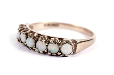 Lot 418 - An opal half hoop ring