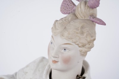 Lot 206 - A pair of German bisque figures with another nodding head figure