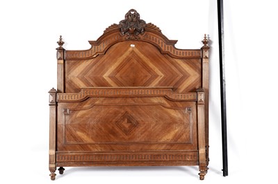 Lot 143 - An early 20th Century French carved walnut bed