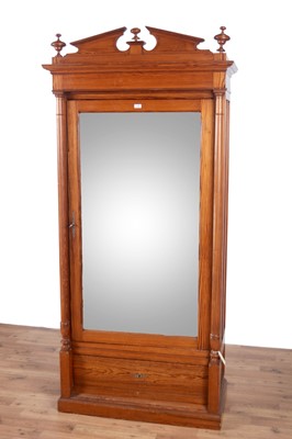 Lot 134 - A 20th Century pine wardrobe