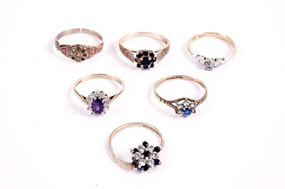 Lot 387 - A solitaire diamond ring; and gemstone and other rings