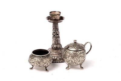 Lot 1424 - An early 20th Century Indian silver dwarf candlestick; and other items