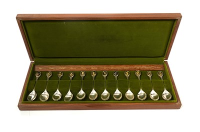 Lot 798 - A set of twelve silver and parcel-gilt Royal Horticultural Society flower spoons