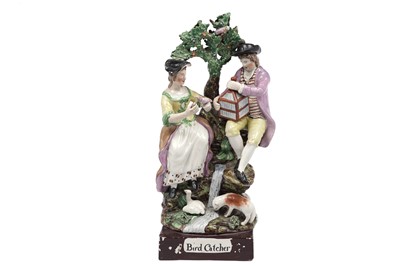 Lot 469 - A Staffordshire pearlware group titled 'Bird Catcher'