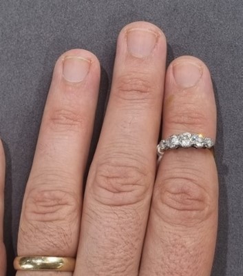 Lot 1250 - A Victorian five stone diamond ring