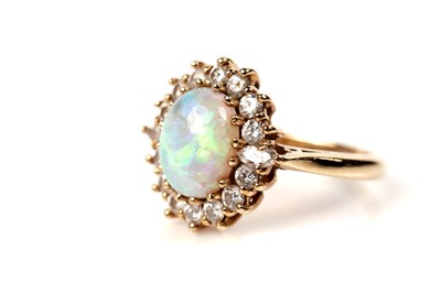 Lot 1252 - An opal and diamond cluster ring