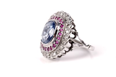 Lot 1119 - A sapphire, ruby, and diamond cluster ring