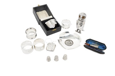 Lot 802 - A silver plated owl pattern pepperette; and other silver items