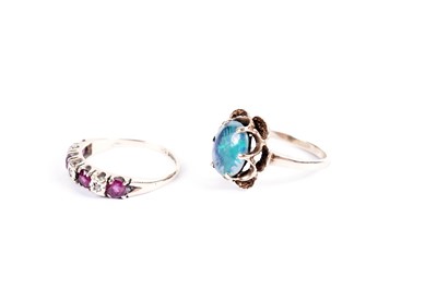 Lot 844 - A diamond and ruby ring; and an opal triplet dress ring