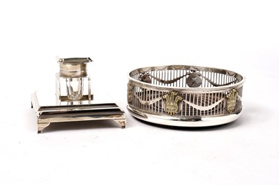 Lot 1362 - A silver and parcel gilt wine coaster; and a silver inkwell