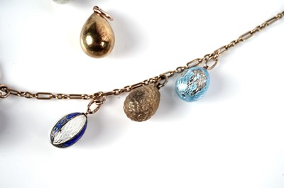 Lot 1297 - Faberge interest: an Easter egg pendant necklace; and two loose eggs