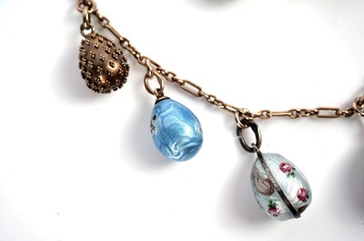 Lot 1297 - Faberge interest: an Easter egg pendant necklace; and two loose eggs