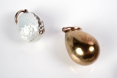 Lot 1297 - Faberge interest: an Easter egg pendant necklace; and two loose eggs