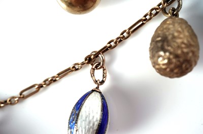 Lot 1297 - Faberge interest: an Easter egg pendant necklace; and two loose eggs