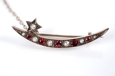 Lot 170 - A Victorian ruby and half-pearl crescent brooch