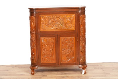 Lot 47 - An Oriental carved hardwood drinks cabinet