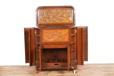 Lot 38 - An Oriental carved hardwood drinks cabinet