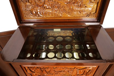 Lot 38 - An Oriental carved hardwood drinks cabinet