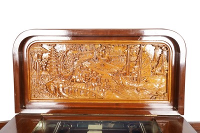 Lot 38 - An Oriental carved hardwood drinks cabinet