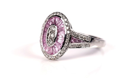 Lot 1289 - A pink-sapphire and diamond cluster ring